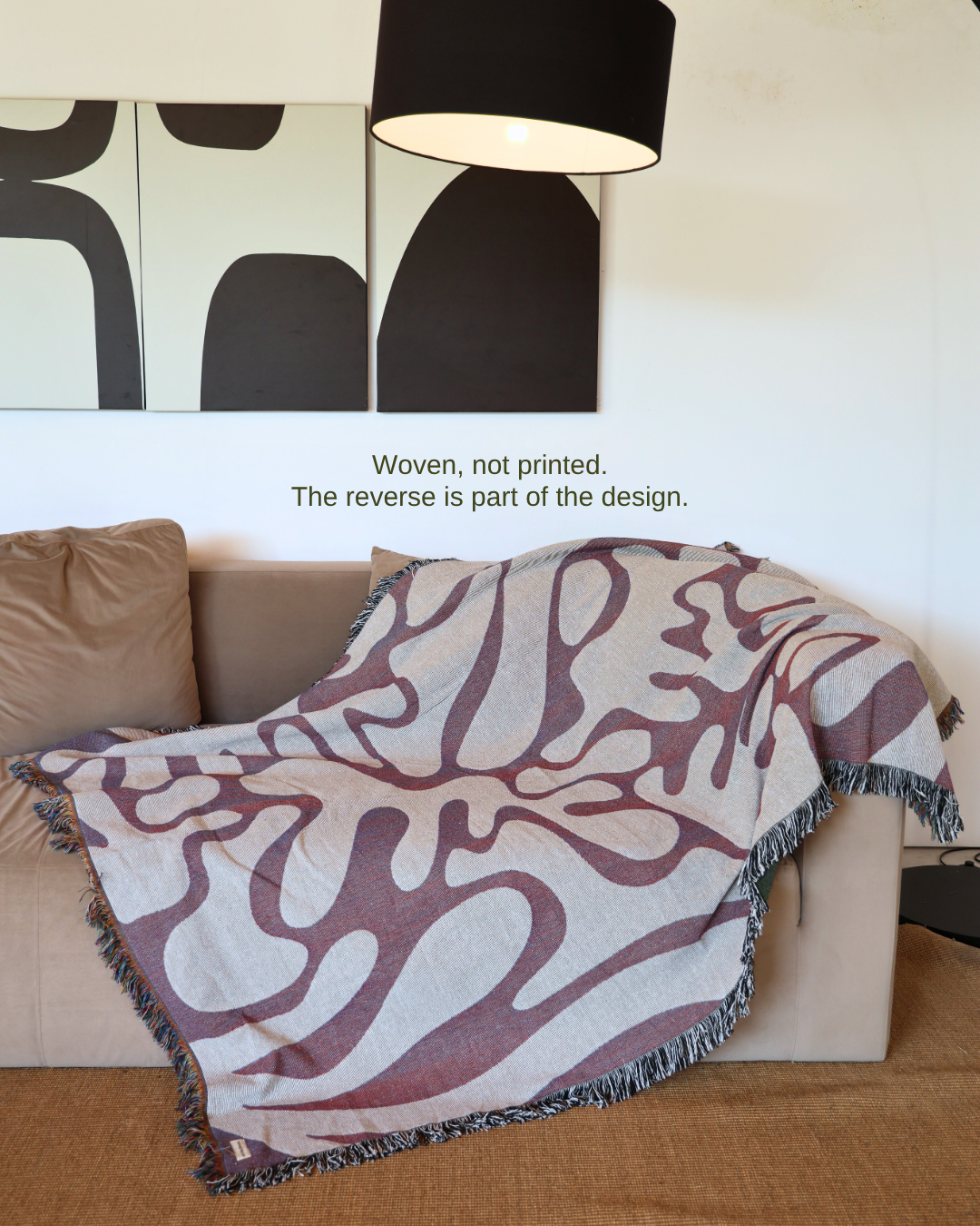 Wildform Rosewood blanket on sofa – woven, not printed