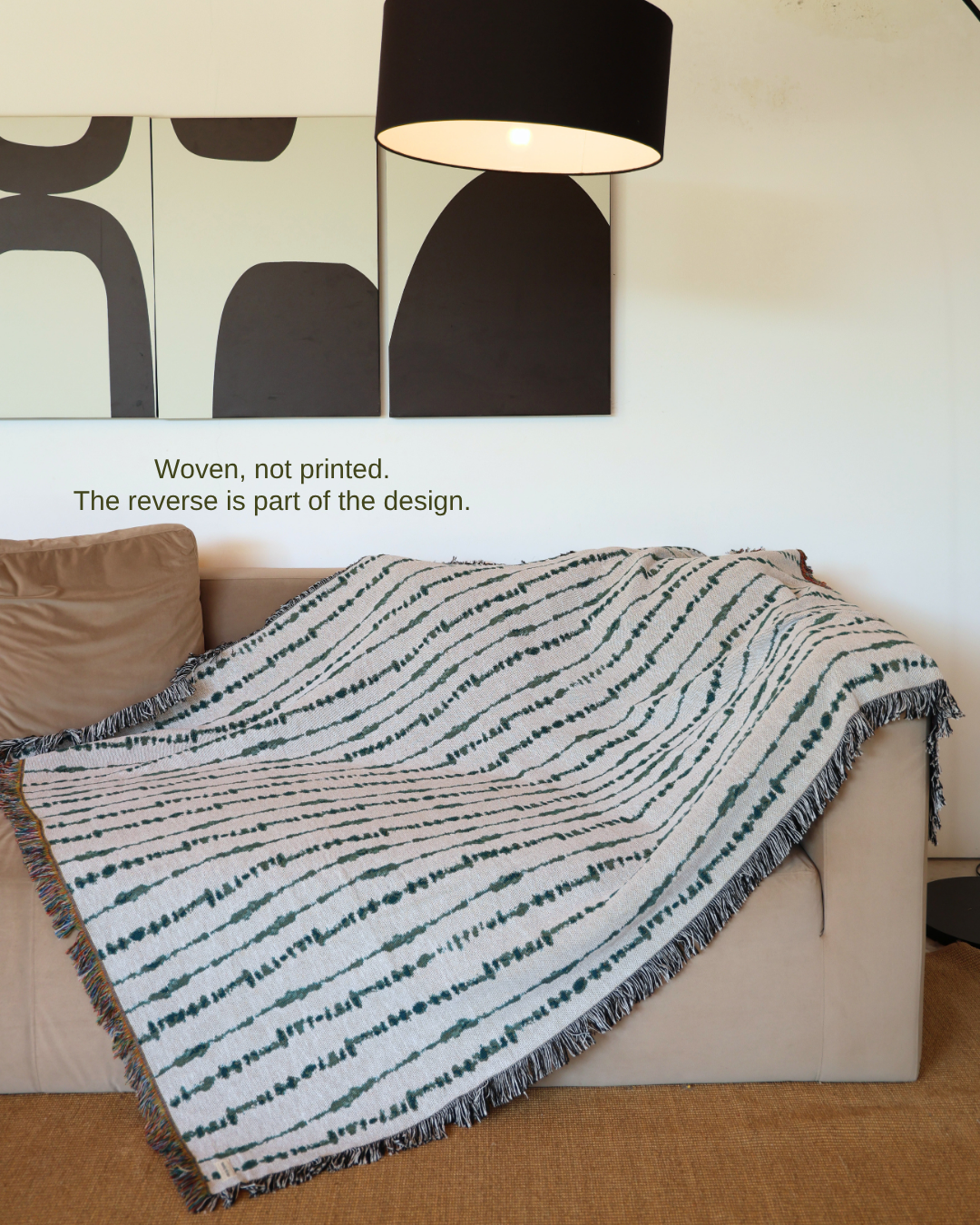Vine Moss blanket on sofa – woven, not printed