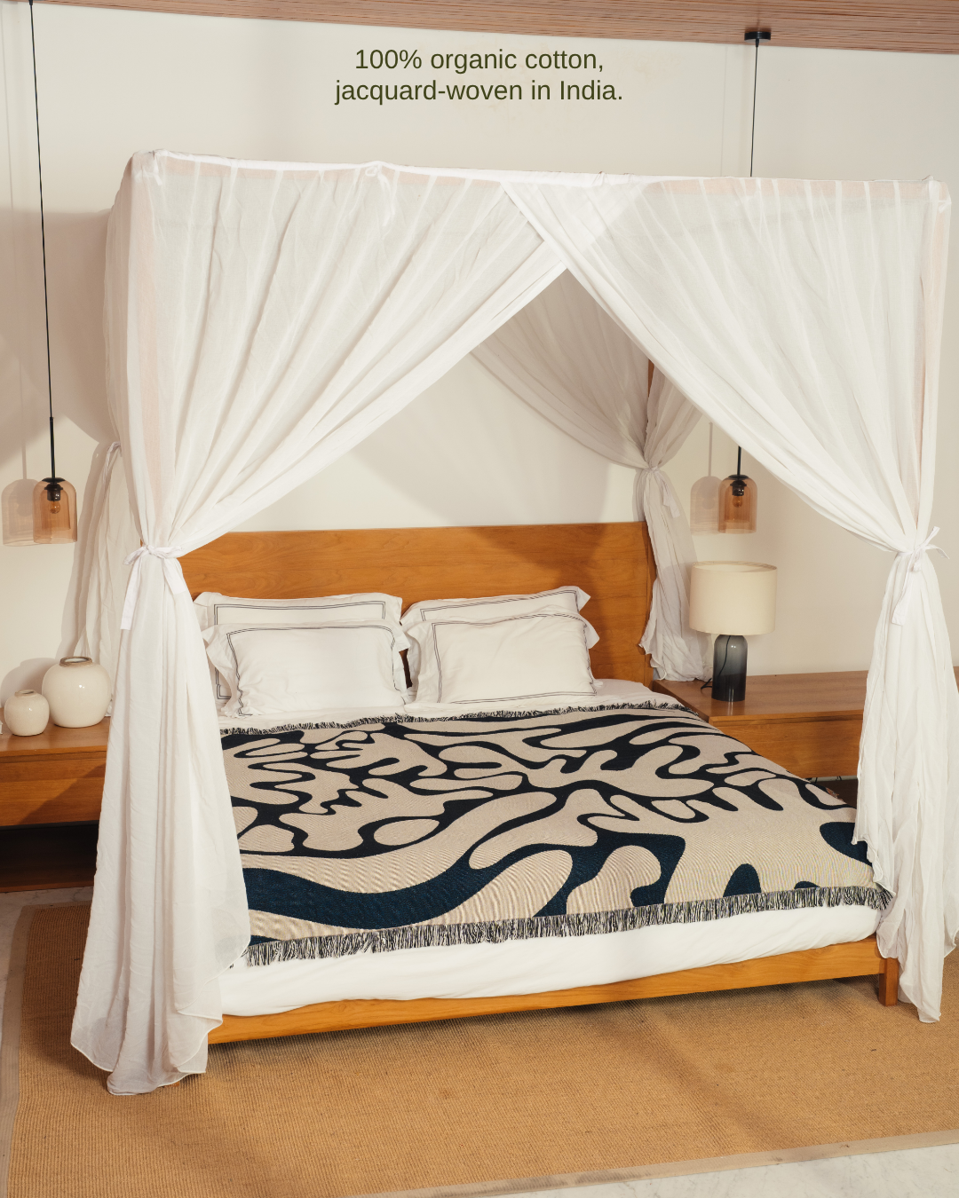 Wildform Onyx blanket on canopy bed – 100% organic cotton, jacquard-woven in India