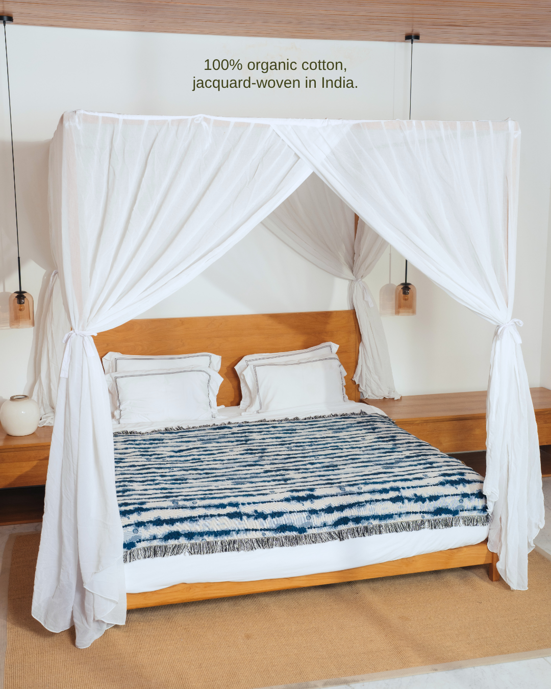 Drift Indigo blanket on canopy bed – 100% organic cotton, jacquard-woven in India