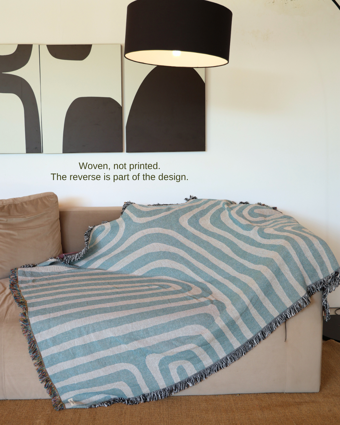 Contour Sky blanket on sofa – woven, not printed
