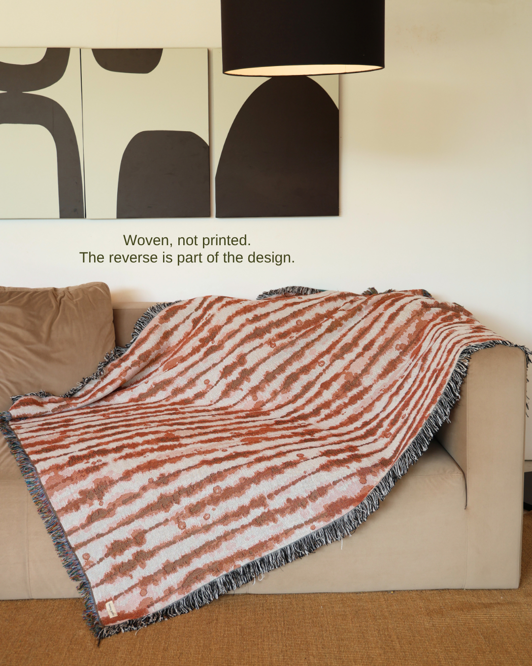 Drift Earth blanket on sofa – woven, not printed