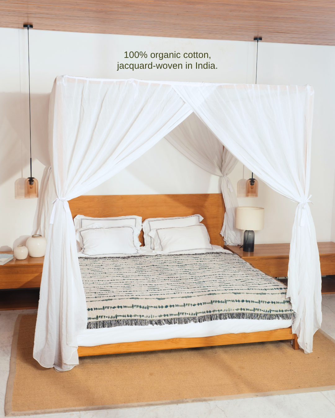 Vine Teal blanket on canopy bed – 100% organic cotton, jacquard-woven in India