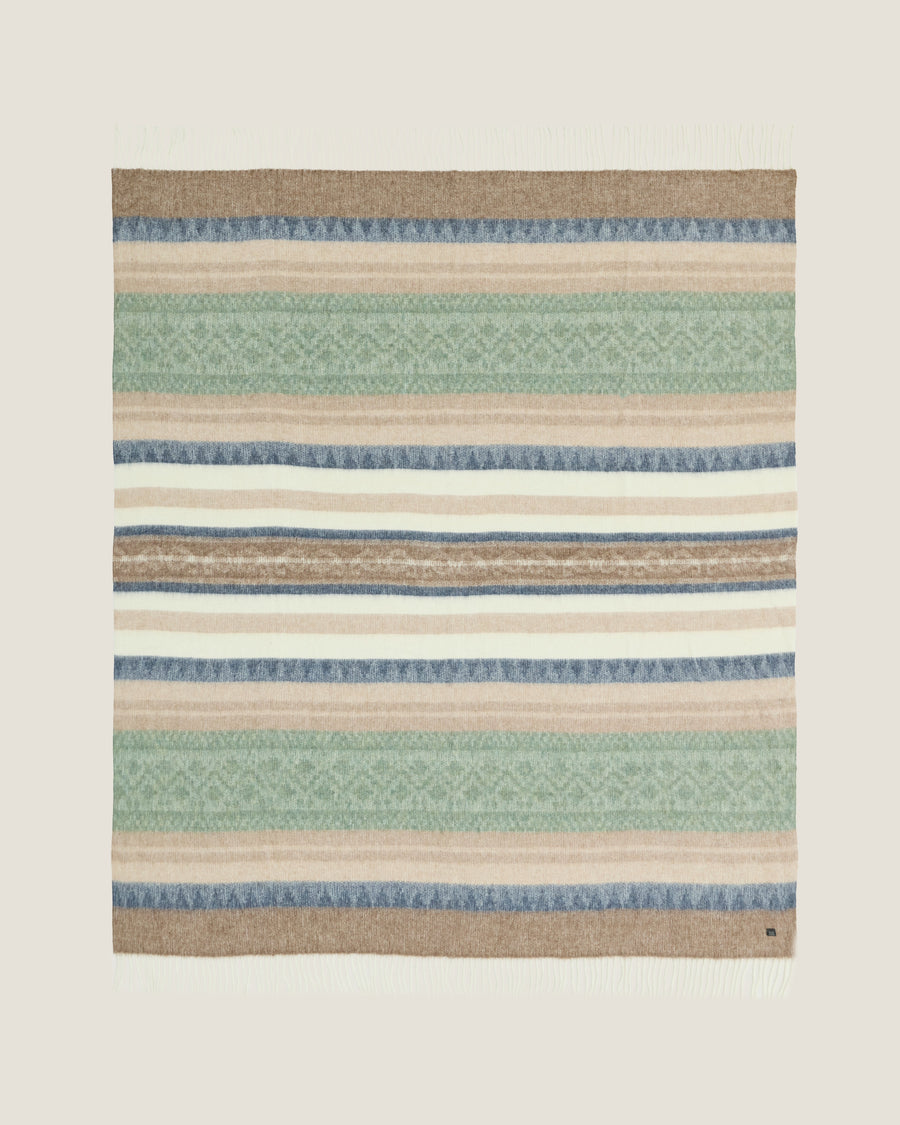 Alpaca Wool Throw Coastal Sage, a throw woven in Peru from alpaca and recycled wool in a soft grey-green