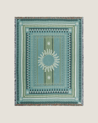 Green blankets and textiles by Naming This Later